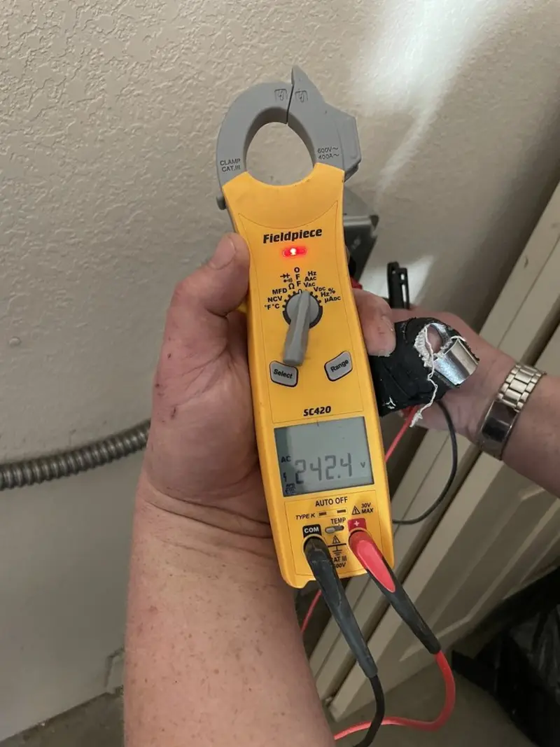Voltage testing with clamp meter during Outlet Installation in Alsip